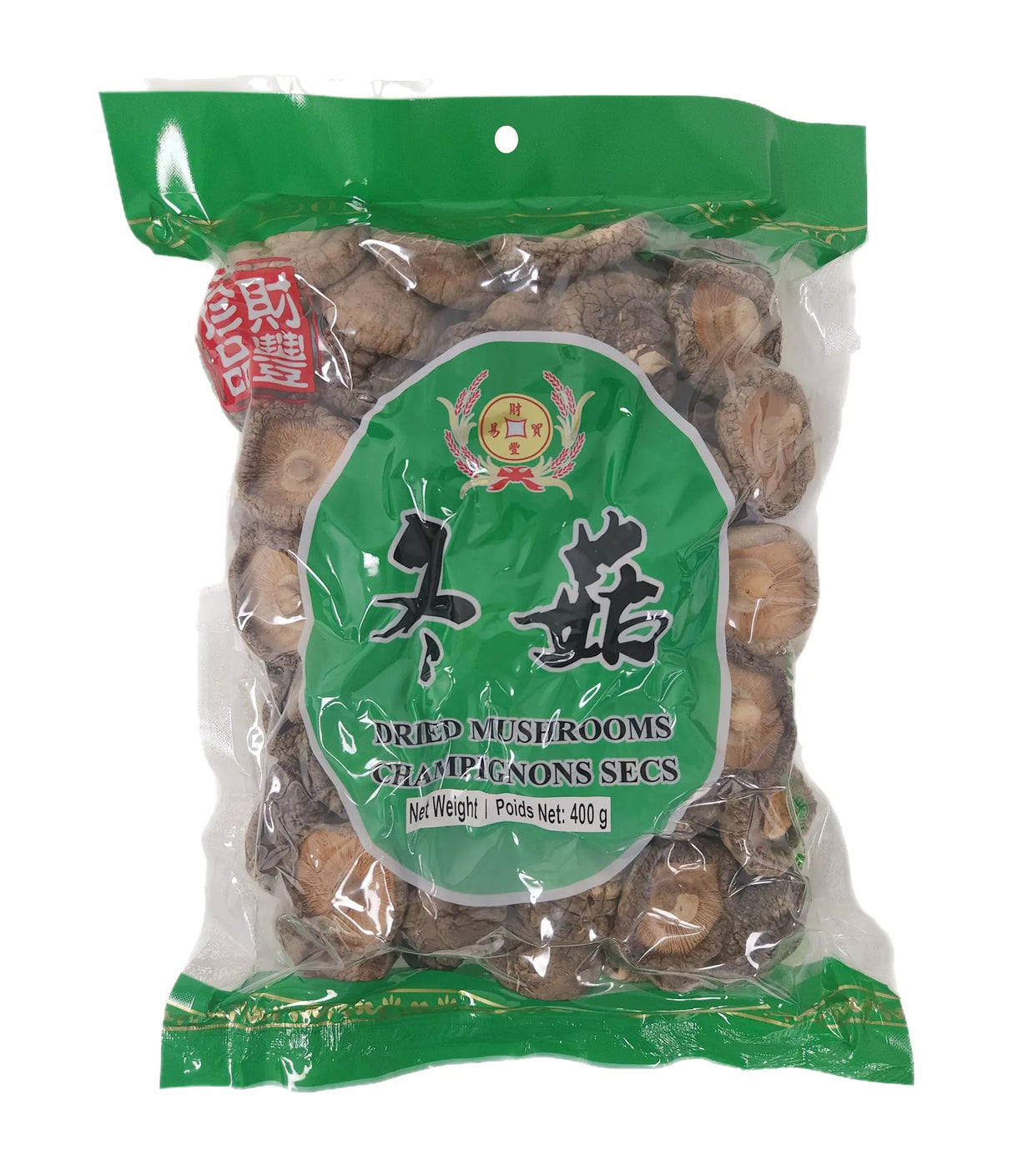 Packaged dried mushrooms with green label on a white background