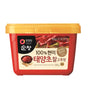 A container of Daesang Hot Pepper Paste (Gochujang) with a red label, predominantly displaying the product name and an image of the paste.