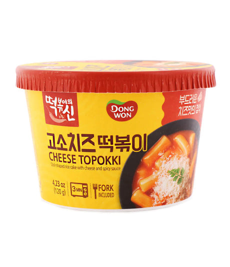 A cup of Dongwon Cheese Topokki, a Korean instant noodle product, with yellow packaging displaying the image of the noodles and cheese.