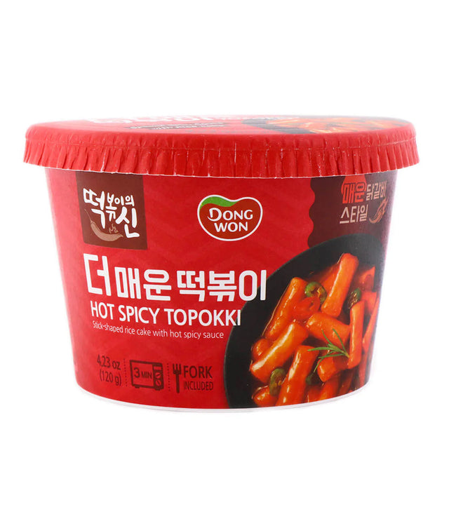 A packaged product of Dongwon Hot Spicy Topokki, a Korean instant noodle dish, with a red lid on a white background.