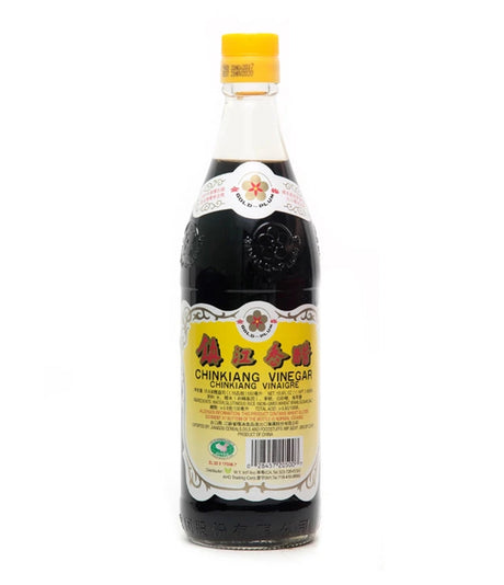 A bottle of Gold-Plum Chinkiang Vinegar 550ml with label in yellow and white colors