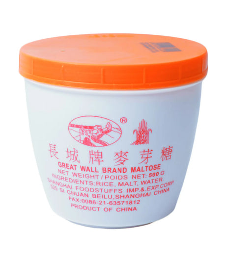 Plastic container of Great Wall Brand Maltose with a white body and orange lid, labeled in Chinese characters