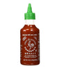 A bottle of Huy Fong Foods Sriracha Hot Chili Sauce with a green cap and label featuring Chinese characters.