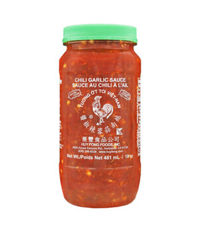 A jar of Huy Fong Foods Chili Garlic Sauce with a red and green label, indicating the flavor of the sauce.