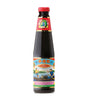 A bottle of Lee Kum Kee Premium Oyster Flavoured Sauce with a label showing an illustration of a person holding a oyster in front of a ocean scene.
