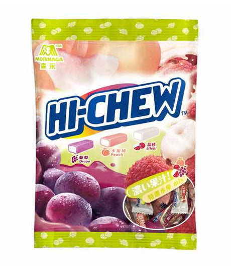 A package of Morinaga Hi-Chew candy featuring grape, peach, and lychee flavors, with images of the fruits on the bag and chewy candy pieces visible.