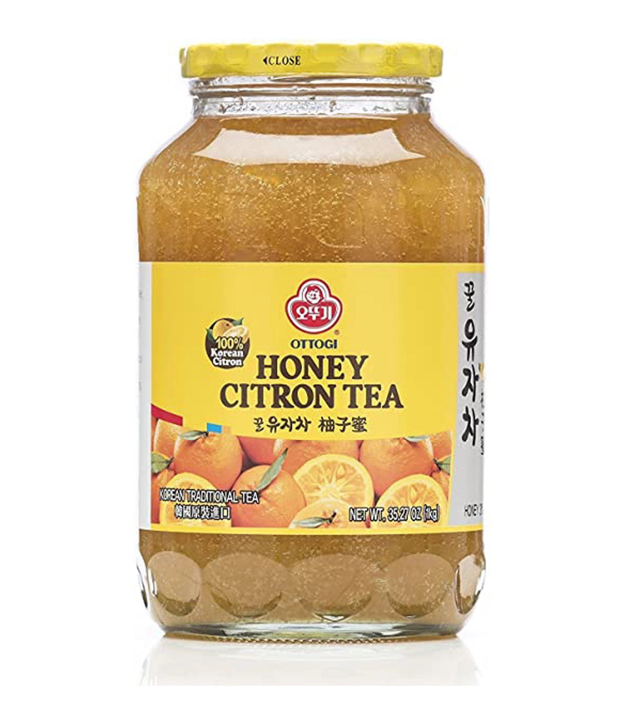 A jar of Ottogi Honey Citron Tea with a yellow label, indicating it is a product of Korea.