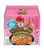 Packaging for Paldo Volcano Carbonara Chicken Noodle. The package is predominantly pink with an illustration of a cartoon chicken character and pasta noodles displayed prominently.