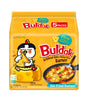 Packaging of Samyang Spicy Chicken Buldak Noodles with Cheese flavor. The package is yellow with an illustration of a cartoon chicken character and text indicating it is a product with 'Artificial Spicy Chicken Flavor Ramen' and comes in '5 PACKS'.