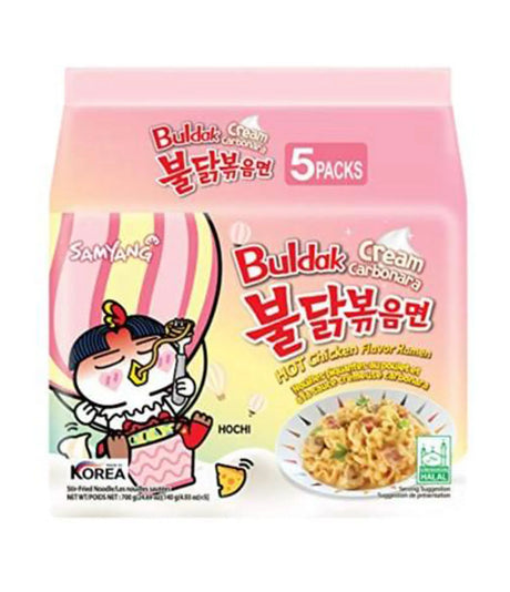 Packaging for Samyang Spicy Chicken Buldak Noodle (Cream Carbonara) showing an illustration of a character eating noodles and the text indicating it is a product of Korea, containing 5 packs, and highlighting the cream carbonara flavor.
