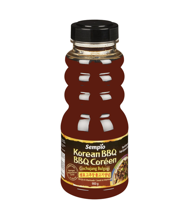 A bottle of Sempio Korean BBQ Marinade (Gochujang Bulgogi) sauce, 900g size, with a label displaying the product name and Korean branding.