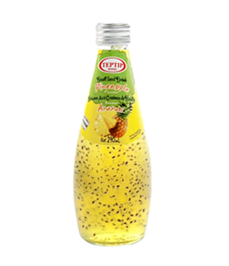 Bottle of pineapple juice with a pineapple on the label against a white background