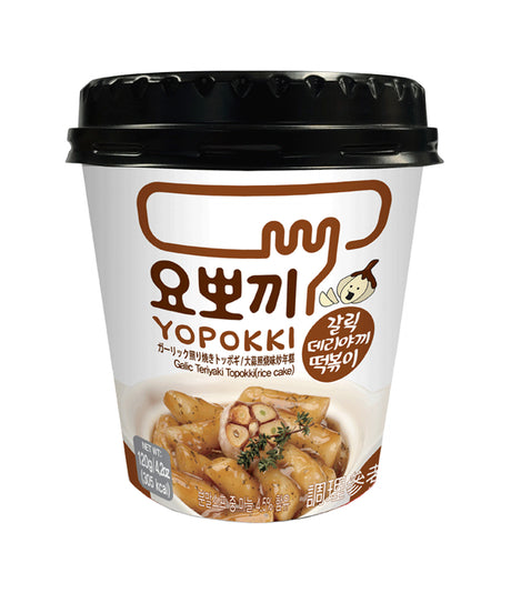 A cup of Young Poong Yopokki Garlic Teriyaki Topokki, showing the product packaging with Korean text and an image of the noodles.