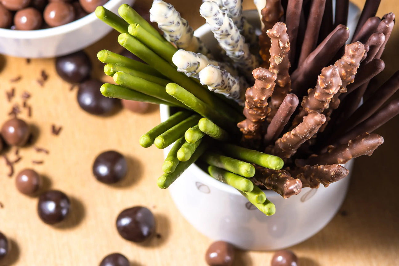 A Mix of biscuit sticks and chocolates 