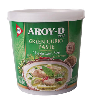 A container of Aroy-D Green Curry Paste with a picture of a bowl of green curry on the label, indicating the product is Thai cuisine flavored.