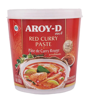 A container of Aroy-D Red Curry Paste with a picture of a bowl of red curry on the label, indicating the product is Thai.