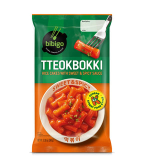 Packaging for Bibigo Tteokbokki Rice Cakes with Sweet & Spicy Sauce showing the product and its sauce.