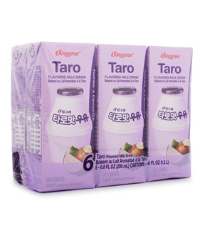 Six cartons of Binggrae Taro Flavored Milk Drink, packaged in purple and white boxes with branding and the image of the drink visible.
