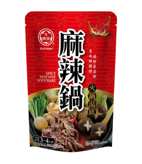 Packaging of Bull Head Spicy Hot Pot Soup Base featuring images of the product, spices, and ingredients on a red background.