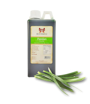 A bottle of Butterfly Pandan Flavouring Extract Paste with a green label, alongside fresh pandan leaves.