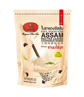 A stand-up pouch of Assam Red Tea Leaves Bubble Milk Tea by Nestlé, featuring a beige background with illustrations of a milk tea splash, black tea leaves, and a glass of bubble tea with tapioca pearls.