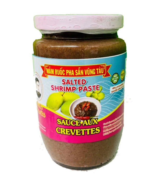 Jar of salted shrimp paste with colorful label on a white background