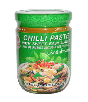 A jar of Cock Brand Chili Paste with Sweet Basil Leaves, 200g, with product information and branding visible on the label.