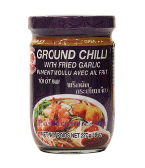 A jar of Cock Brand Ground Chili with Fried Garlic, 227g, with label displaying the product name and an image of the chili and garlic.