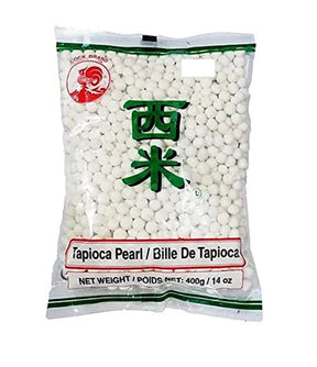 Packaging of Cock Brand Tapioca Pearl, showing white tapioca pearls in a clear plastic bag with green and red label.