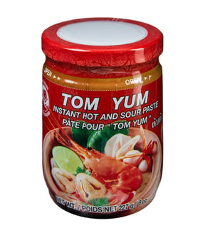 A jar of Cock Brand Tom Yum Instant Hot & Sour Paste, showing the product name, a picture of a shrimp, and the text 'Product of Thailand'.