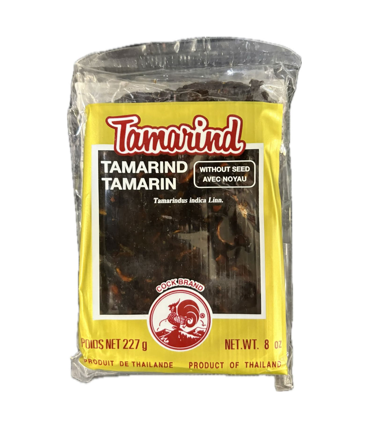 A 8 oz bag of Tamarind without seed, featuring a bright yellow label with red and white text and a photo of dark brown tamarind pieces inside a clear plastic pouch.