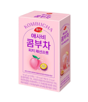 Kombucha box with pink packaging featuring a fruit illustration on a white background