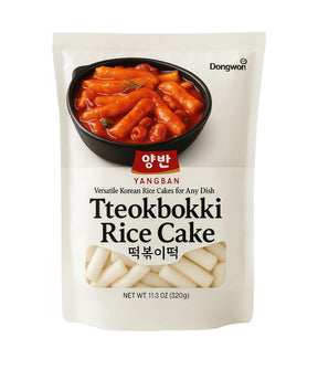 Packaging of Dongwon Yangban Tteokbokki Rice Cake with a bowl of rice cakes in red sauce on a white background.