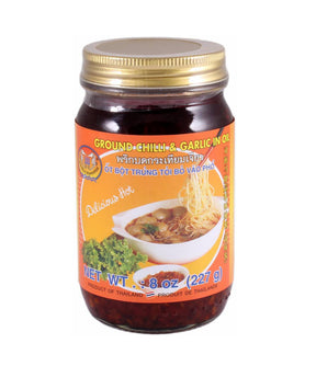 A jar of Double Seahorse Ground Chili & Garlic in Oil, with label showing the product name and an image of a bowl with chili and garlic.