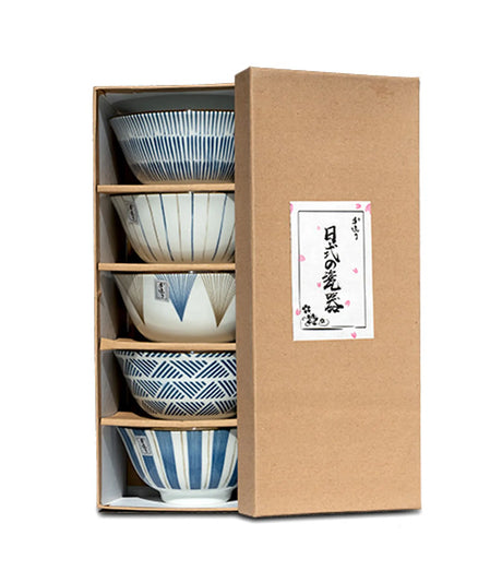 Set of ceramic bowls in a wooden box with a decorative label on a white background