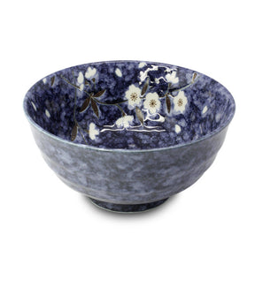 A Japanese porcelain bowl with a deep blue color and white floral patterns.