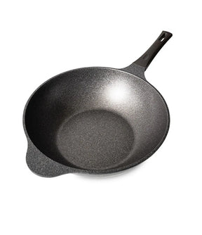 Black cast iron skillet on a white background