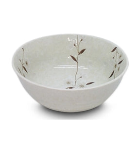 White ceramic bowl with subtle floral patterns on a white background
