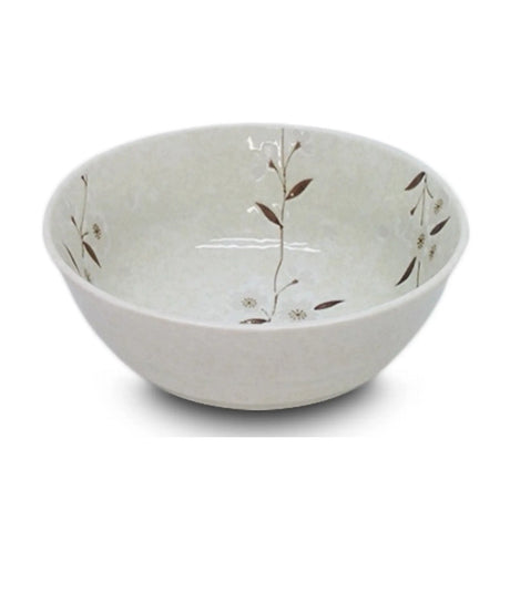 White ceramic bowl with subtle floral patterns on a white background