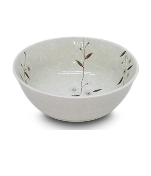 White ceramic bowl with subtle floral patterns on a white background