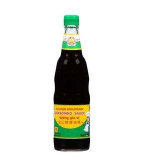 Bottle of Golden Mountain Seasoning Sauce with a green cap and a label that includes the brand name and product name in both English and Thai script.