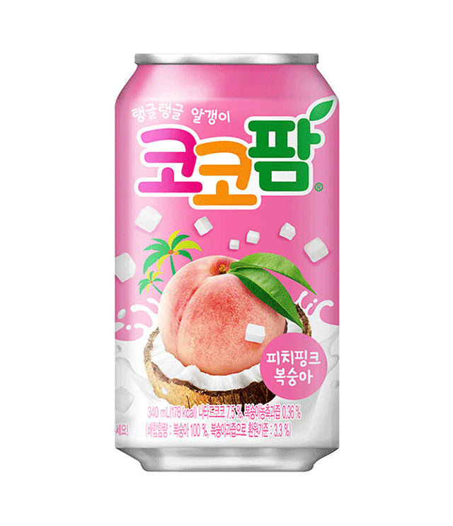 A pink can of Haitai beverage with Korean text and a graphic of a peach on the front, shown on a plain white background.