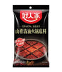 Black package of Sichuan pepper oil for hot pot base with red text and image on a white background