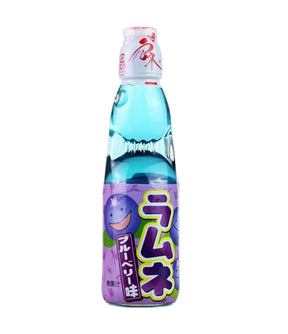 A bottle of Hata Ramune Soda with blueberry flavor, predominantly purple and transparent in color with Japanese text on the label.