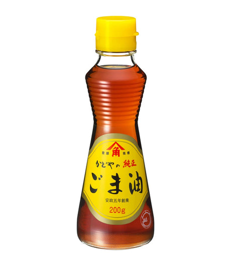A 200g bottle of Japanese soybean oil (goma-oyu) with a bright yellow cap and a yellow label featuring black and red Japanese text, set against a plain white background.