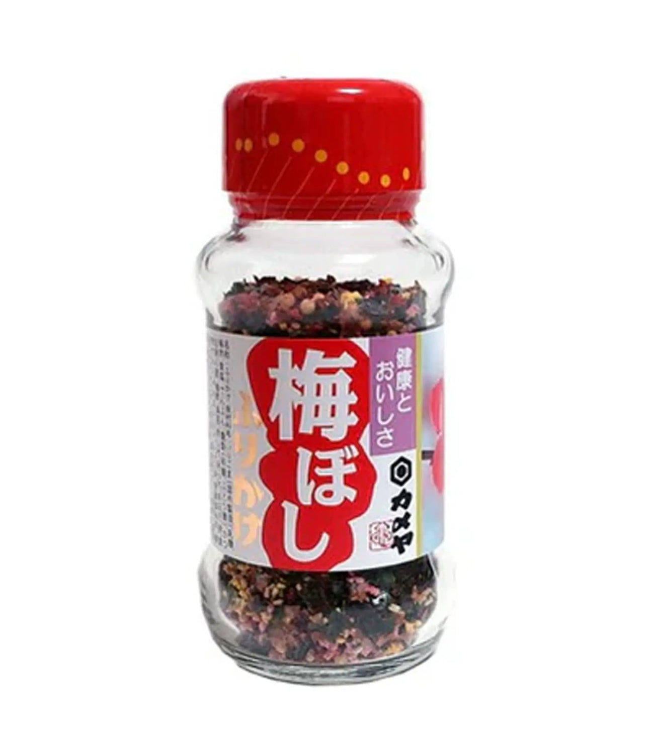 A clear glass bottle of Japanese plum powder seasoning with a red cap and a white and red label featuring Japanese text.