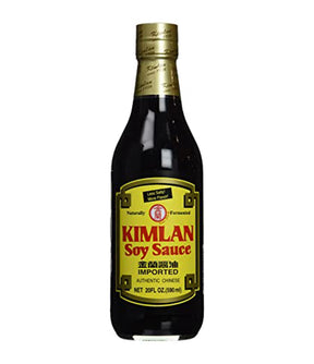 A bottle of Kimlan Soy Sauce 590ml with label in yellow and red colors indicating the product is soy sauce.