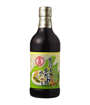 A bottle of Kimlan Vegetarian Mushroom Oyster Sauce with a label that includes green text and an image of a mushroom. The sauce is presented in a dark glass bottle with a white cap.