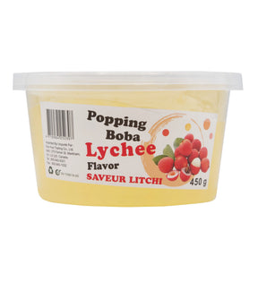 A container of Kuo Hua Popping Boba with Lychee Flavor, 450g size, with lychee images and text on the label.