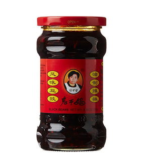 A jar of Lao Gan Ma Chili Sauce with Black Beans, 280g, with label information in Chinese characters
